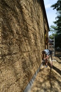 Straw Bale Wrapping in Plank